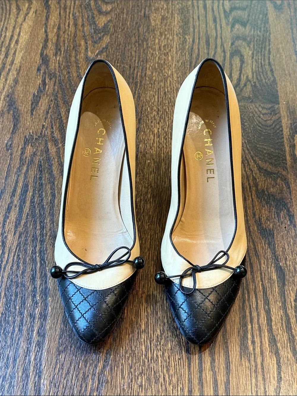 CHANEL Beige and Black Quilted Cap-Toe Bow Pumps size 39